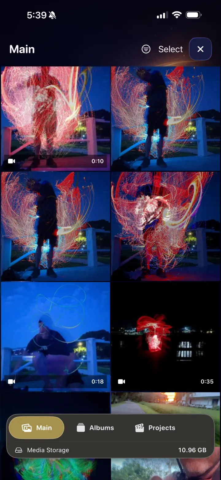 LightPaint media gallery showing a mixed grid of light painting photos and videos