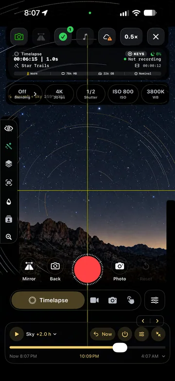 TimeLapsed Camera view with sky paths enabled, with an illustrated scene beneath the captured camera controls